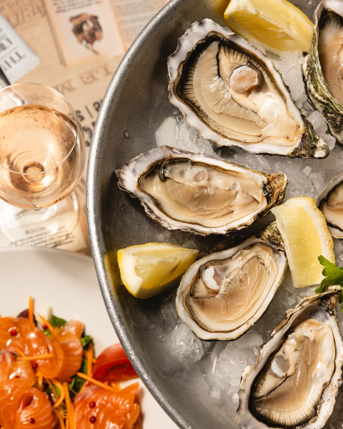 Freshly shucked oysters on ice with lemon
